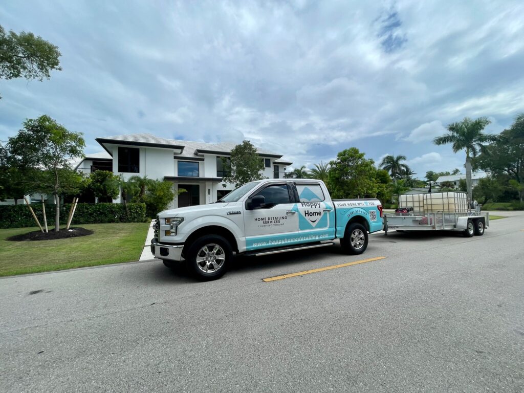 happy home truck in front of clean house