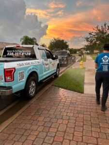 Pressure washing driveway in Naples Florida by Happy Home Detailing