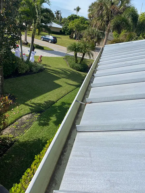 Gutter on a metal roof after Happy Home Detailing cleaned it out.